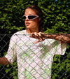 Cool and Sexy women leaning on tennis fence wearing printed tennis t-shirt